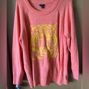 Adorable sweater!! Worn a few times. Bright orange with a yellow tiger.